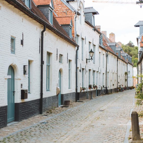 tiny white flemish houses in a row at the small beguinage in leuven